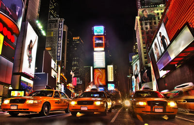 Times Square at Night Time and Yellow Cabs in New York City